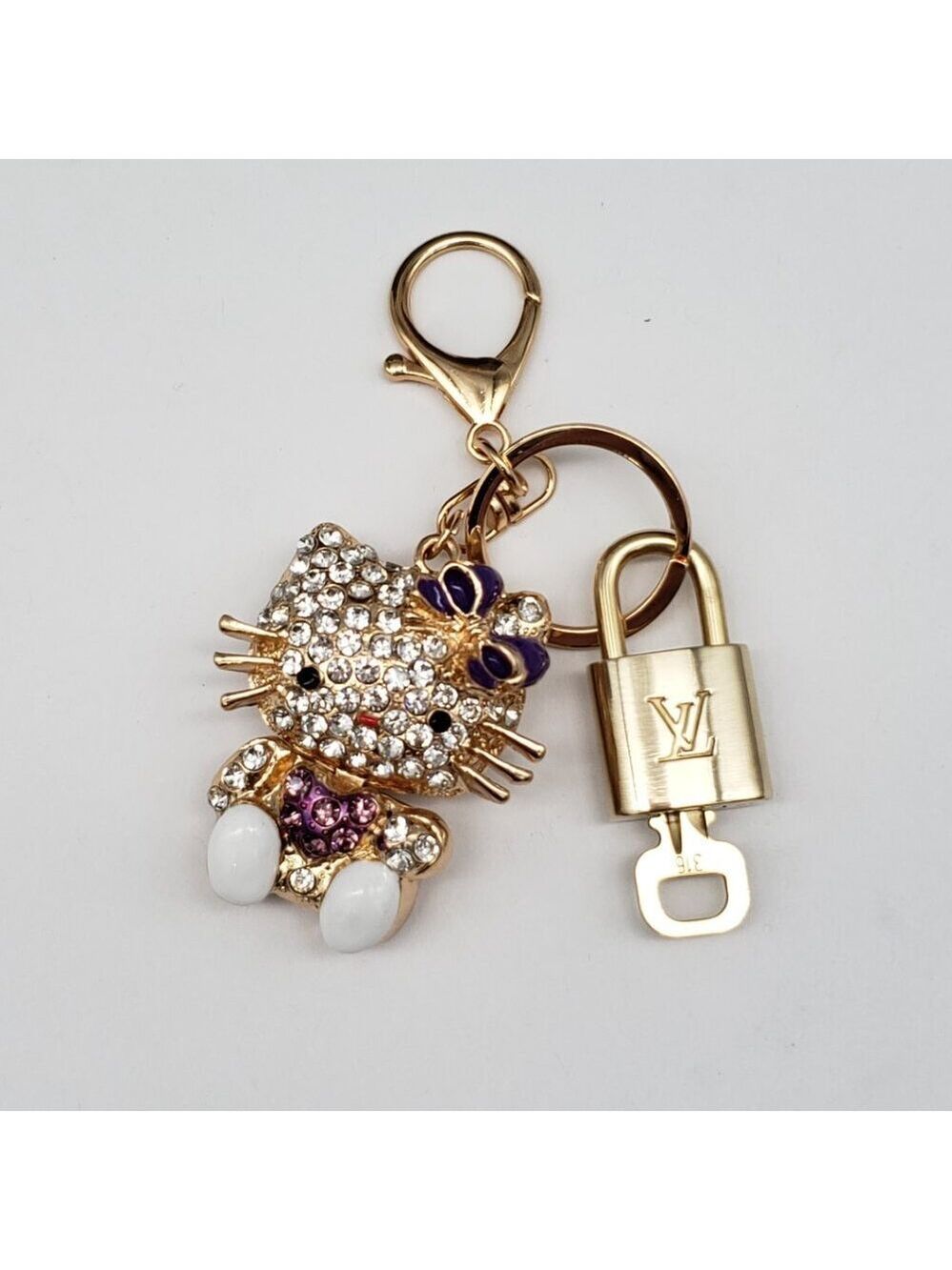 Louis Vuitton Gold Lock 🔒 Authentic LV Key + Unbranded Hello Kitty Bag Charm